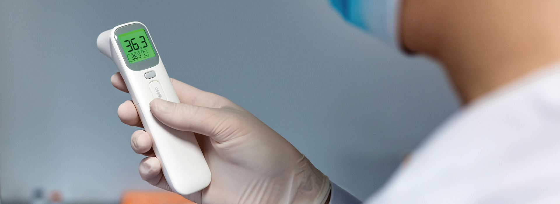Close up of using a non-contact thermometer