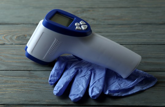 Infrared thermometer and disposable gloves