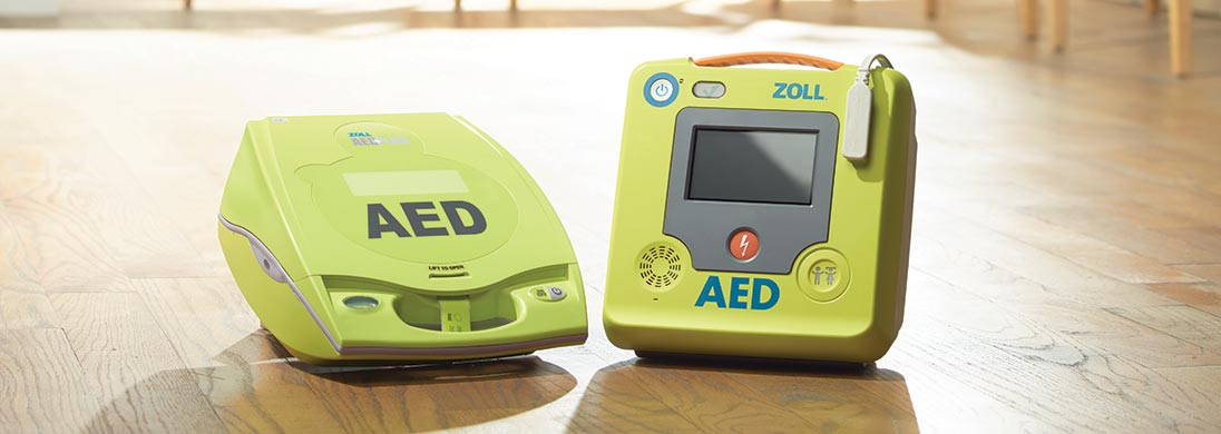 Zoll AED Plus Defibrillator on wooden floor