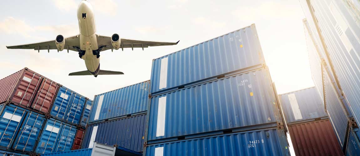 Air logistics. Cargo airplane flying above stack of logistic container. Cargo and shipping business.