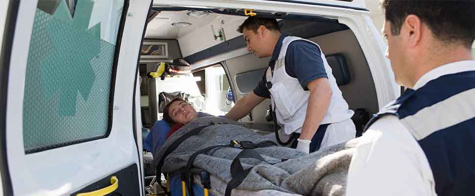 Ambulance staff and patient on stretcher
