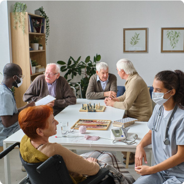 A group of elderly people at a care home