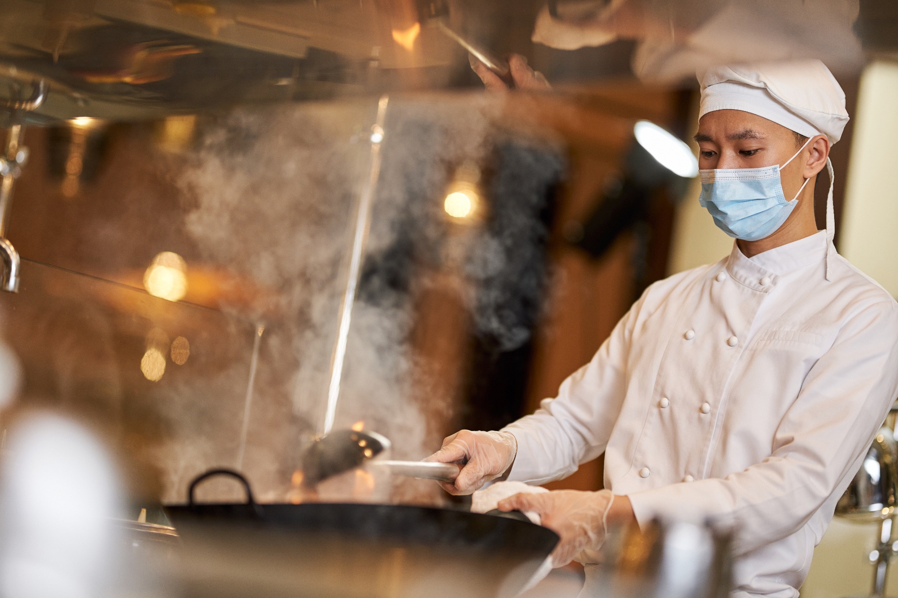 Chef in steamy kitchen