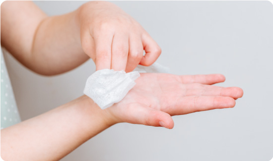 Child wiping her hands