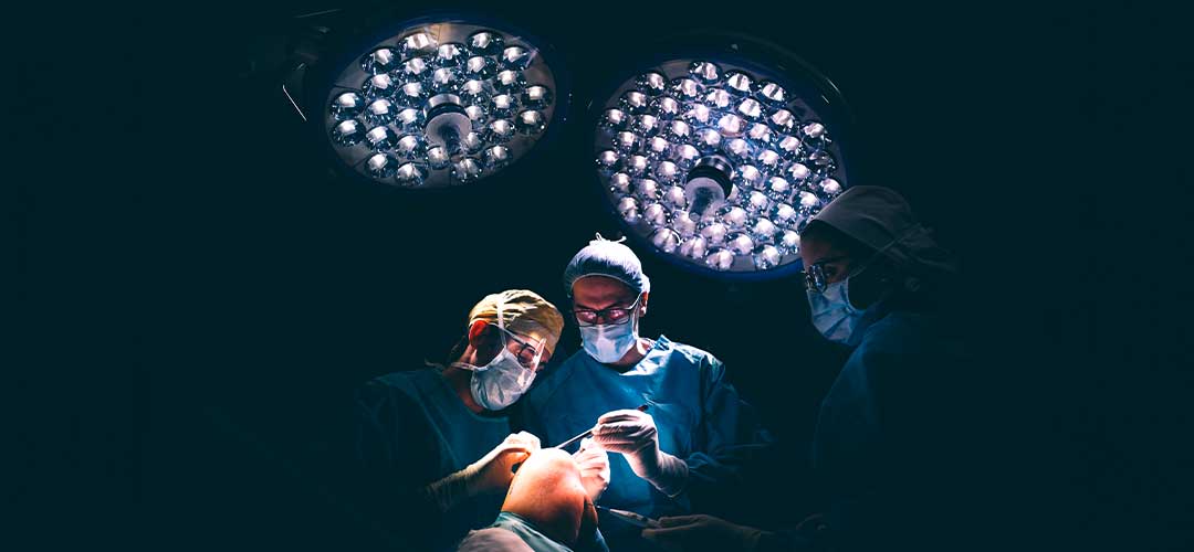 Doctors operating kneecap.