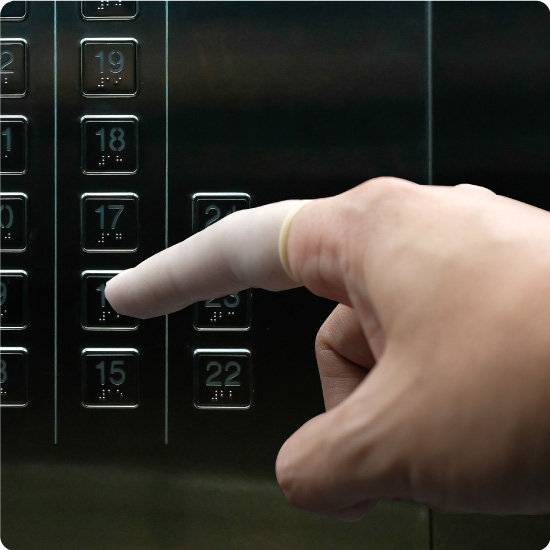 Someone Using a Finger Cot in an Elevator
