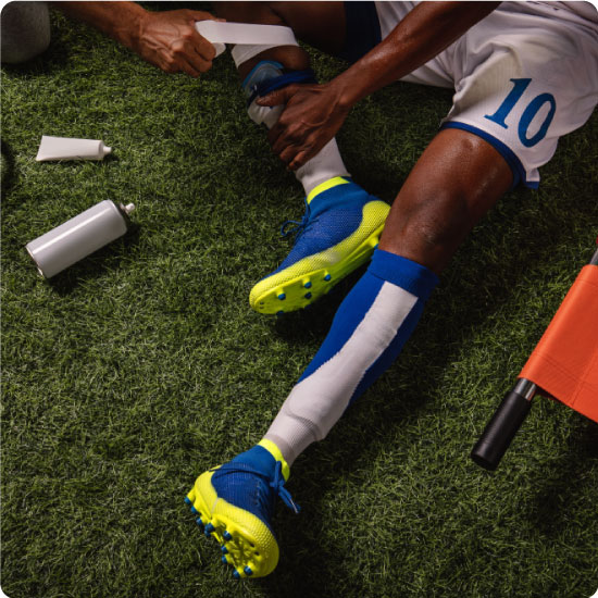 Footballer receiving first aid