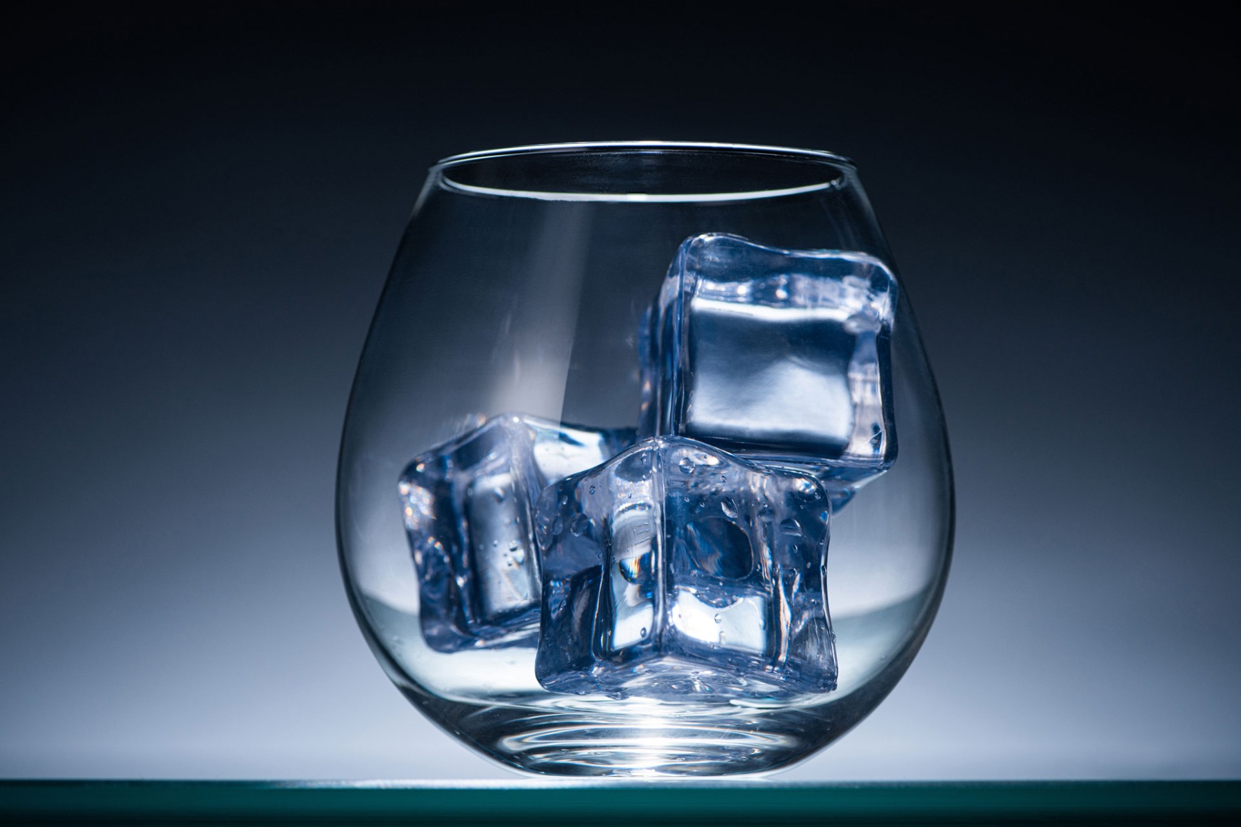 Ice cubes in glass of water