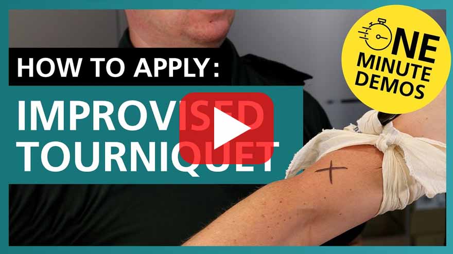 Video thumbnail showing a person demonstrating how to apply an improvised tourniquet using cloth on an arm marked with an 'X'. Text reads 'How to Apply: Improvised Tourniquet' with a yellow badge saying 'One Minute Demos'. A play button is centred on the image.