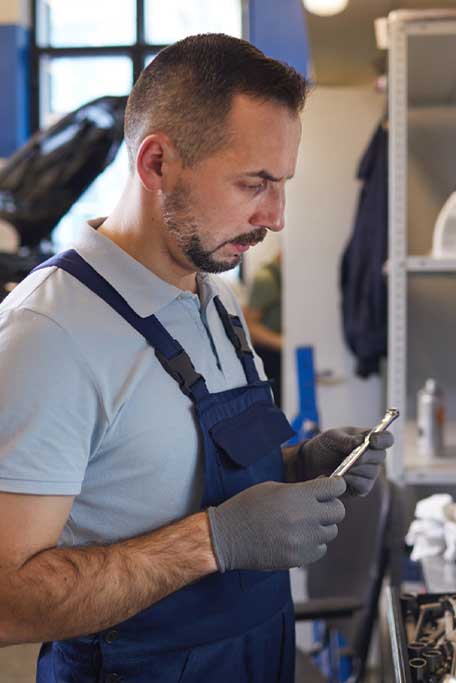 Mechanic Choosing Tools wearing nitrile gloves