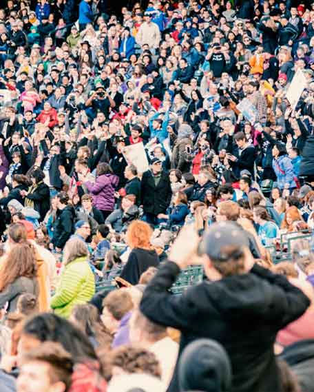 People filled stadium seats cheering