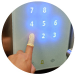 Person Using Touch Screen with Finger Cot