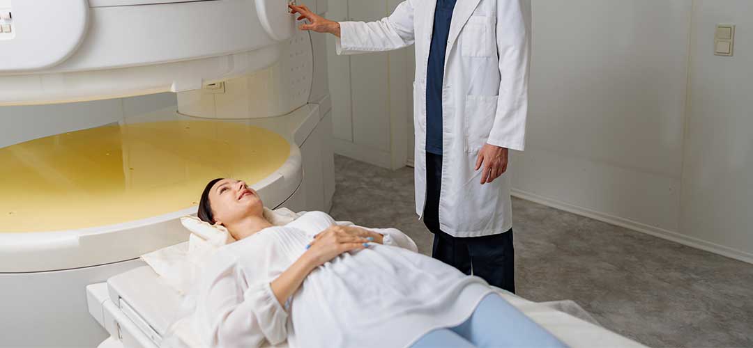 Radiologist controls machine