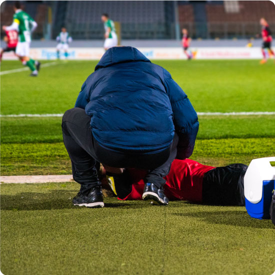 Footballer recieivng first aid pitch side
