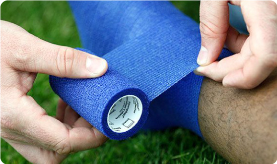 Cohesive Bandage being used on ankle