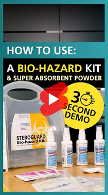 Promotional image for a 30-second demo on using a Steroguard Biohazard Kit and Super Absorbent Powder. Features the biohazard kit, bottles of disinfectant spray, and other kit components on a table, with a play button overlay in the centre