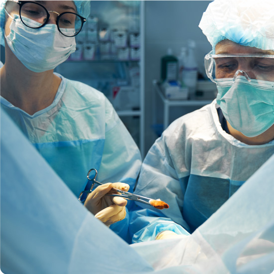 Surgeons Using Forceps