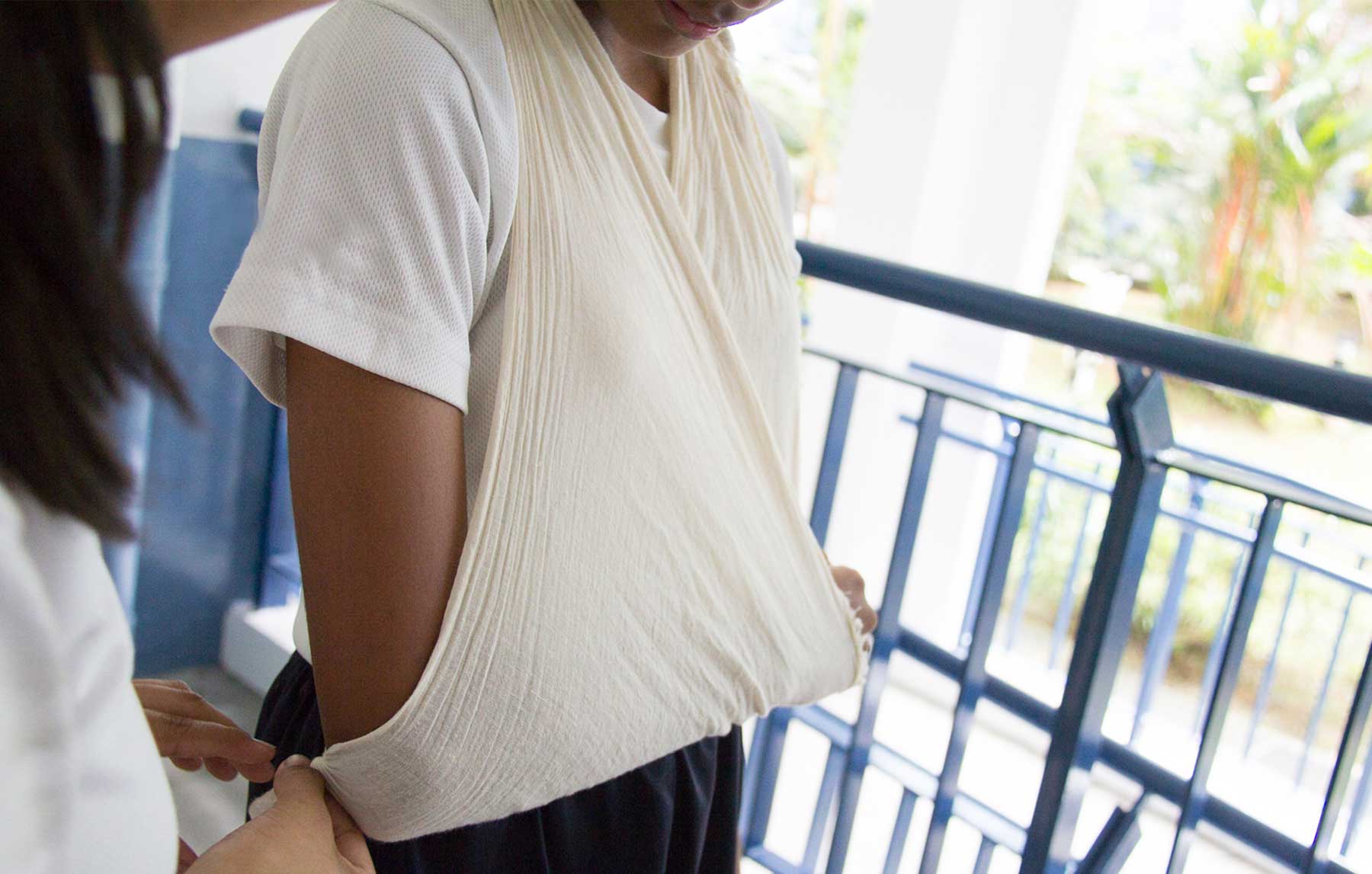 Teenage girl in arm cast