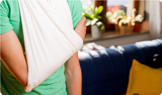 Triangular Bandage being used as a sling