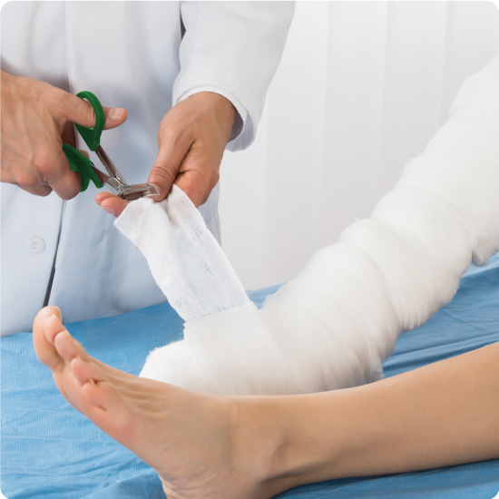 Doctor Using Tuff Cut Scissors to cut through bandage