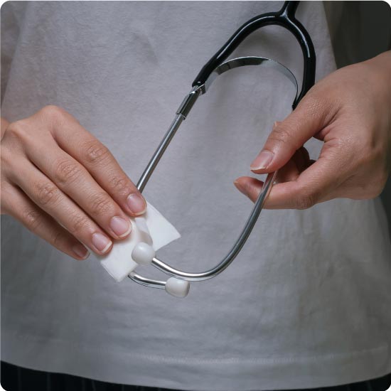 Woman Wiping Stethoscope