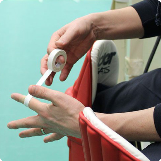 Zinc Oxide Tape Bing Applied to Finger