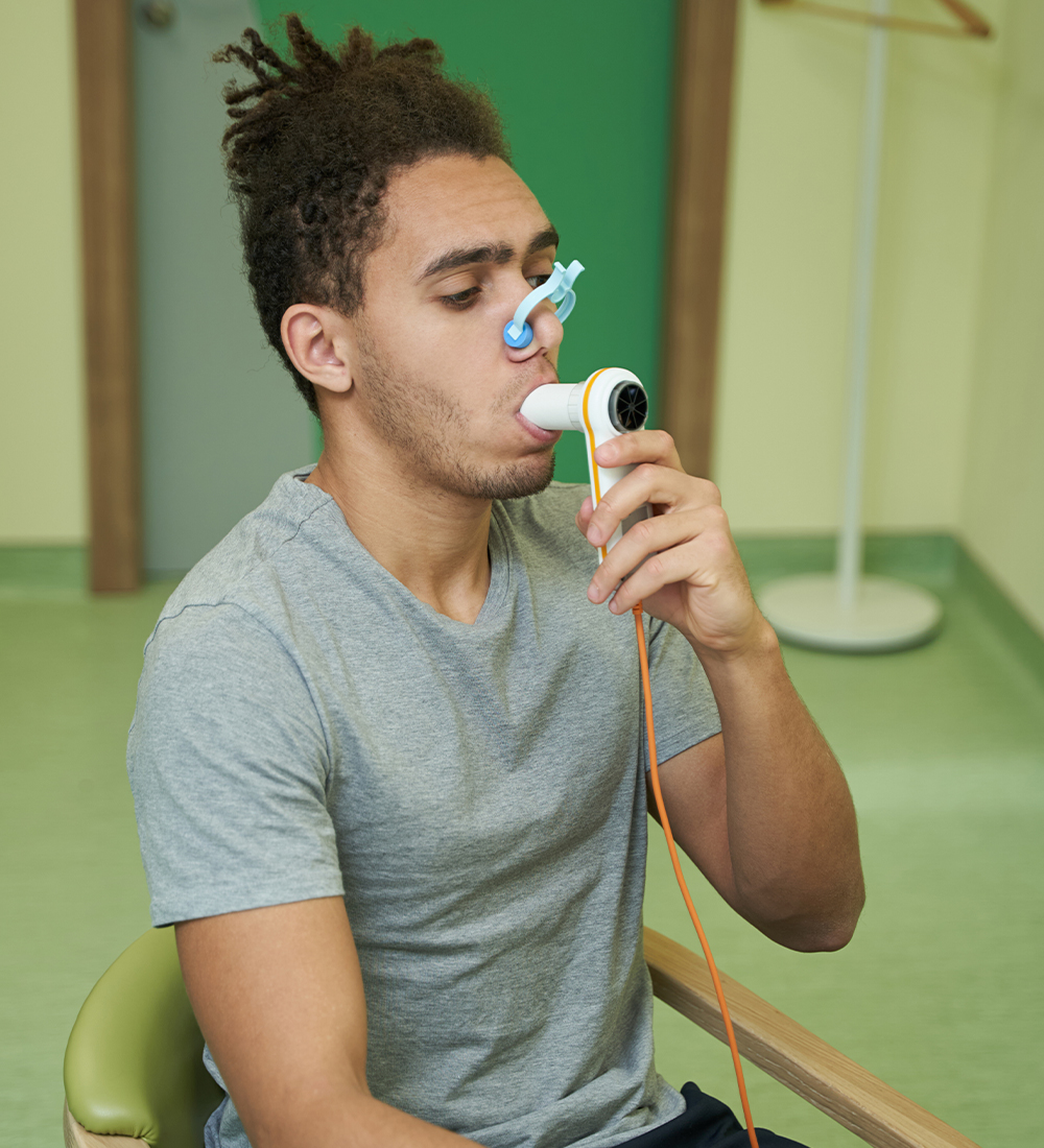 blowing into a spirometer