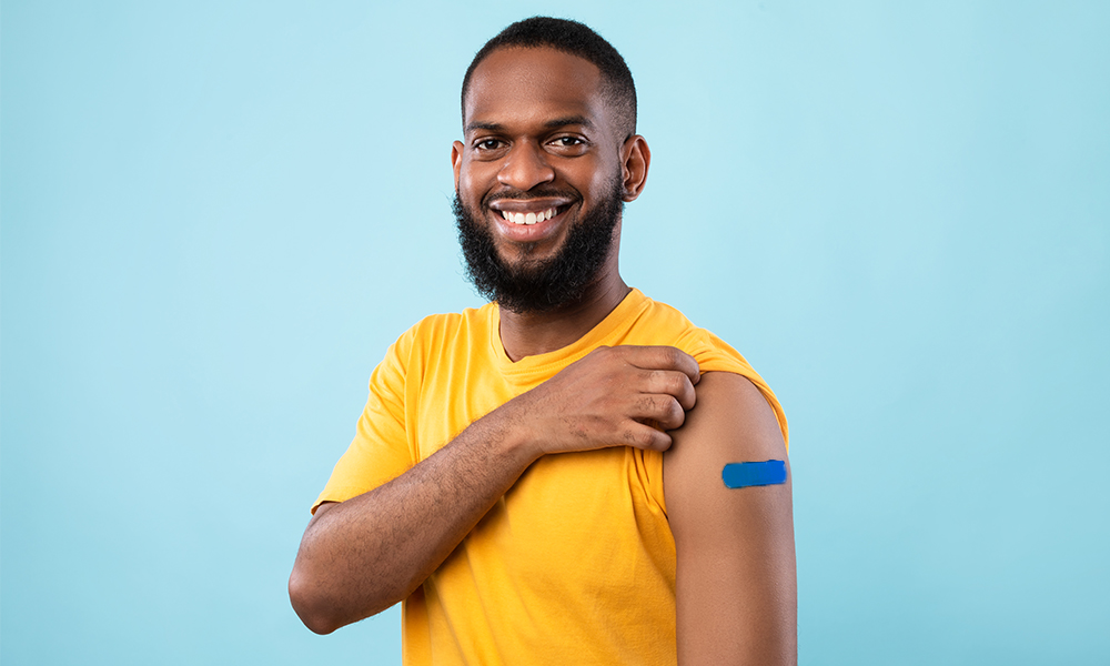 blue plaster on mans arm