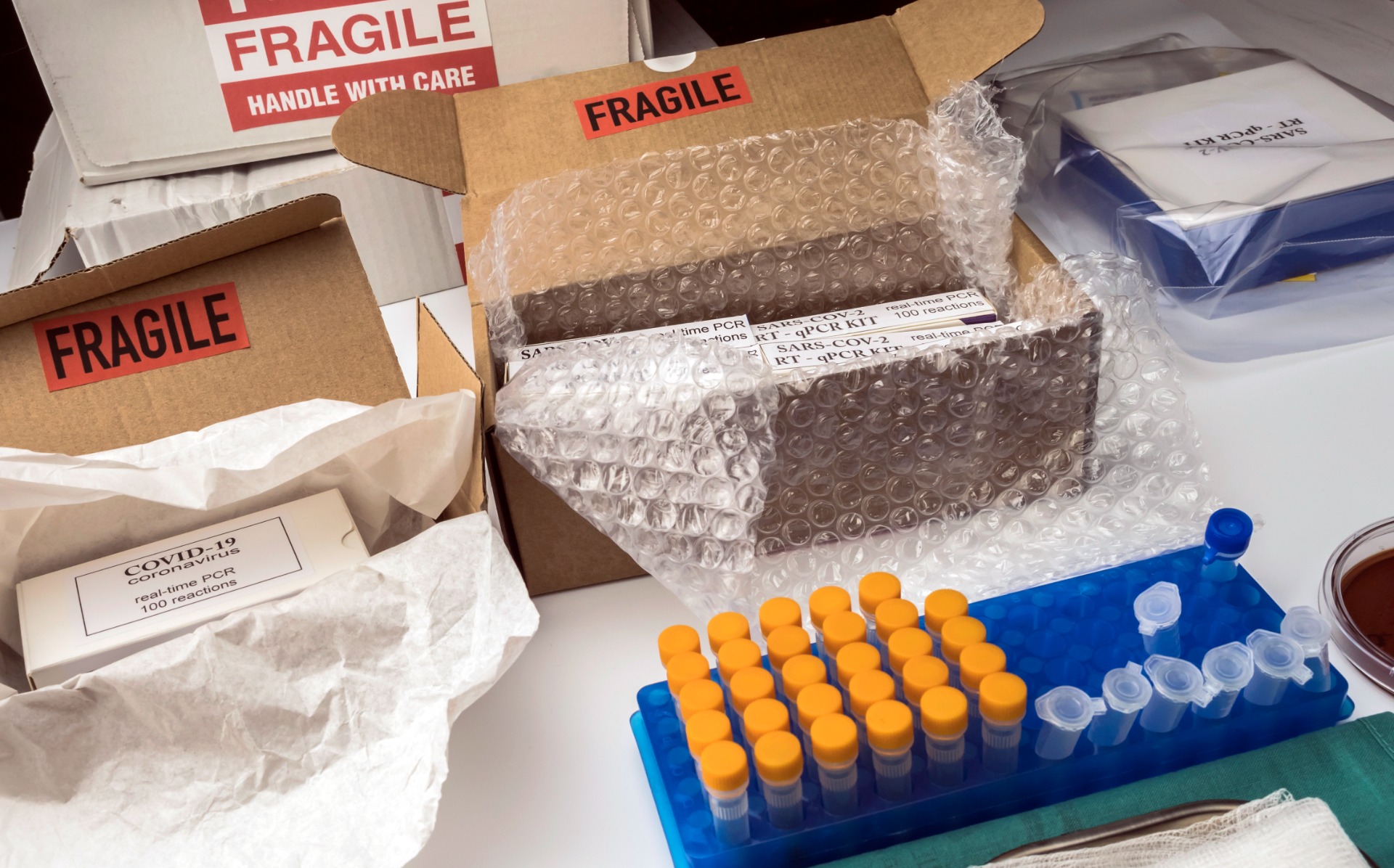 Boxes with Covid-19 PCR kit in hospital warehouse, conceptual image