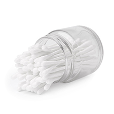 Clear jar with cotton buds spilling out