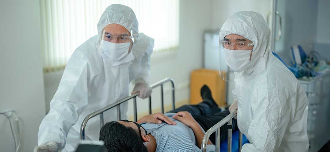 doctors wearing ppe masks and aprons in hospital