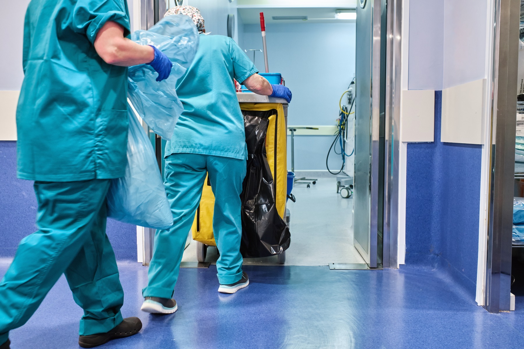 hospital cleaning trolley being pushed by nurses