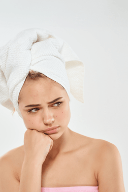 Girl sad in a towel