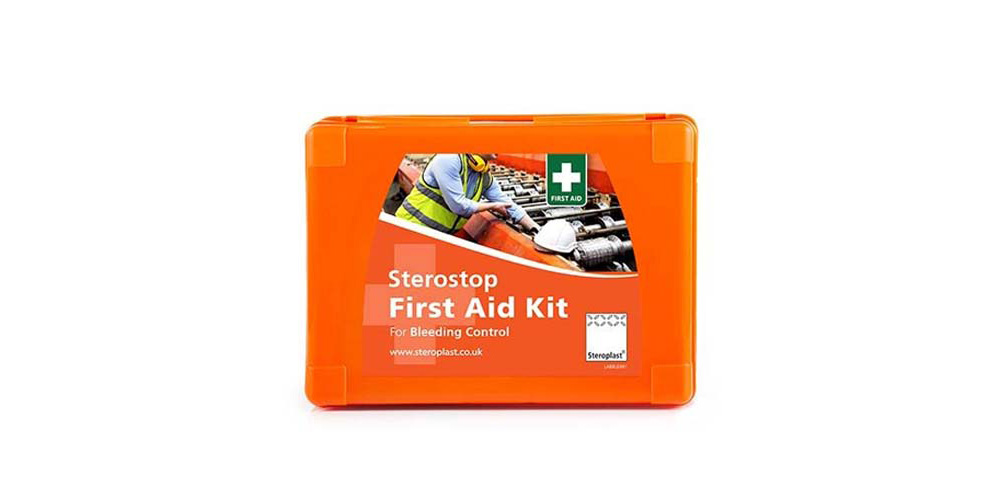 Orange Sterostop First Aid Kit for bleeding control, featuring an image of a worker in a high-visibility jacket handling equipment. The kit's label includes a white cross indicating first aid, along with the Steroplast logo.