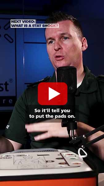 Instructor describing AED pad placement, with focus on guidance and safety.